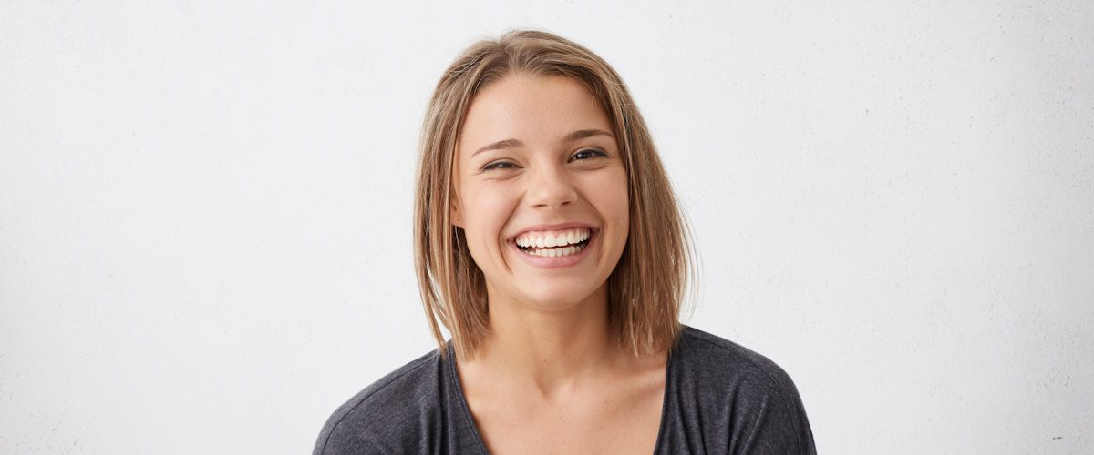 AdobeStock_160361497 Attractive woman with short fair hair being very glad smiling with broad smile showing her perfect teeth having fun indoors. Joyful excited cheery femlae rejoicing after being proposed to marry SSUCv3H4sIAAAAAAAEAJ2RTW7DIBCF95V6B4u1LQUMdtyrRF1MgLijOKYCnKqKfPfyYyTW3fG+mQfzhtf7W9OQKziU5KN5RRU0LsvmvAWPZg341B5cK/TGIiwRRranCnEe/Oa0i1ccSILXc+jN8PCXdy5ZN6WQisERSoS0FXPbNbGC9vbfznz4LFFg1qv8TQNXQaxeNOQgl9xK7j9e20cd7YlKm0rDptBUKZ9GwhINfXXzt0WJ61zZjP/Stt5YWLl5VGA1Pk1yBCMqrDRK2lNOp6nntBdnygc6kvINRt5R1bOiio4bh2FgbOiYEqzjehy7SU6sG4CKs+Bi5LdT2NT+Byk4WHQOAgAA